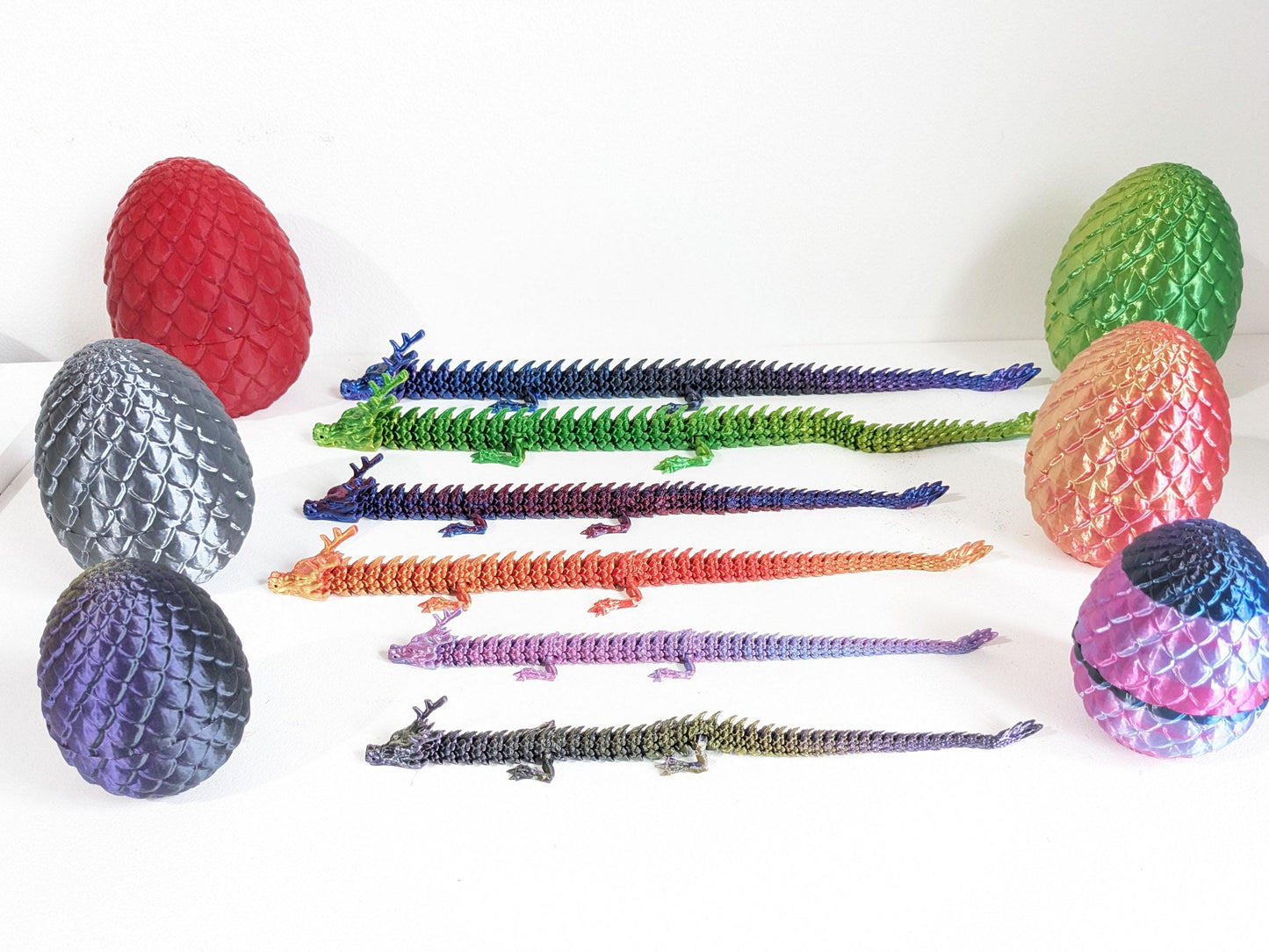 Articulated Crystal slinky Dragon 3d printed horned fidget toy. Three sizes with or without egg. UK made top quality.