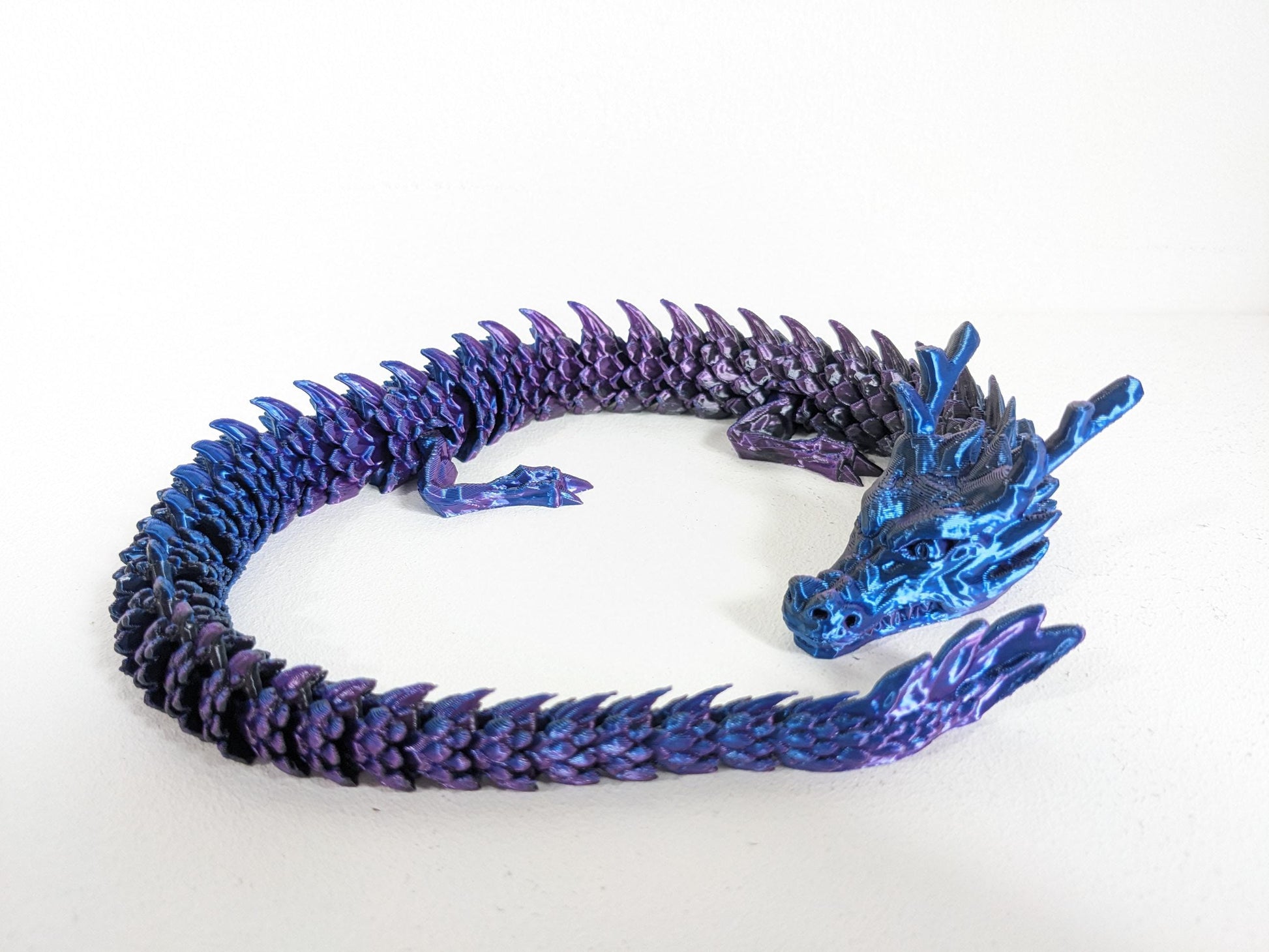 Articulated Crystal slinky Dragon 3d printed horned fidget toy. Three sizes with or without egg. UK made top quality.