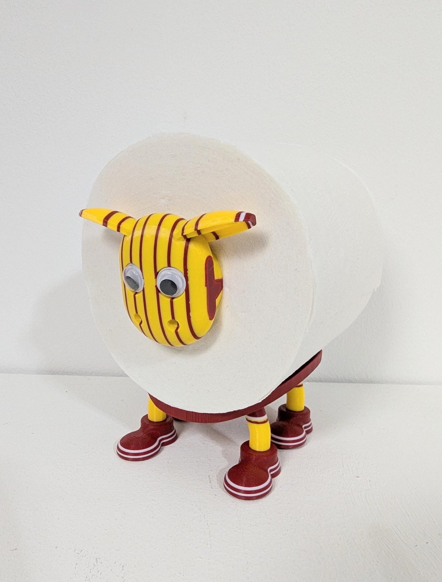 Motherwell Scottish Premier Sheep toilet roll holder. 2025 Home shirts with the steelmens customised football boots.