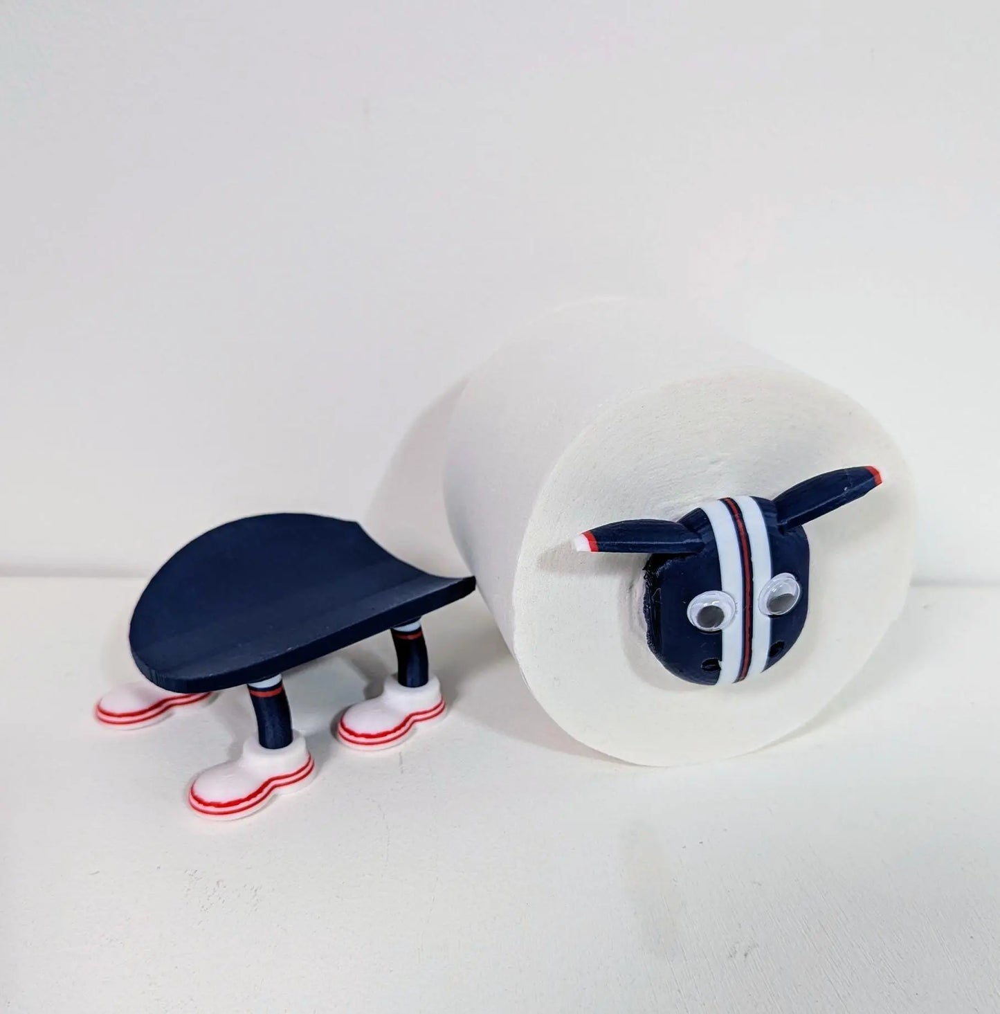 Dundee Scottish Premier Sheep toilet roll holder. 2025 Home shirt with the dees customised football boots.