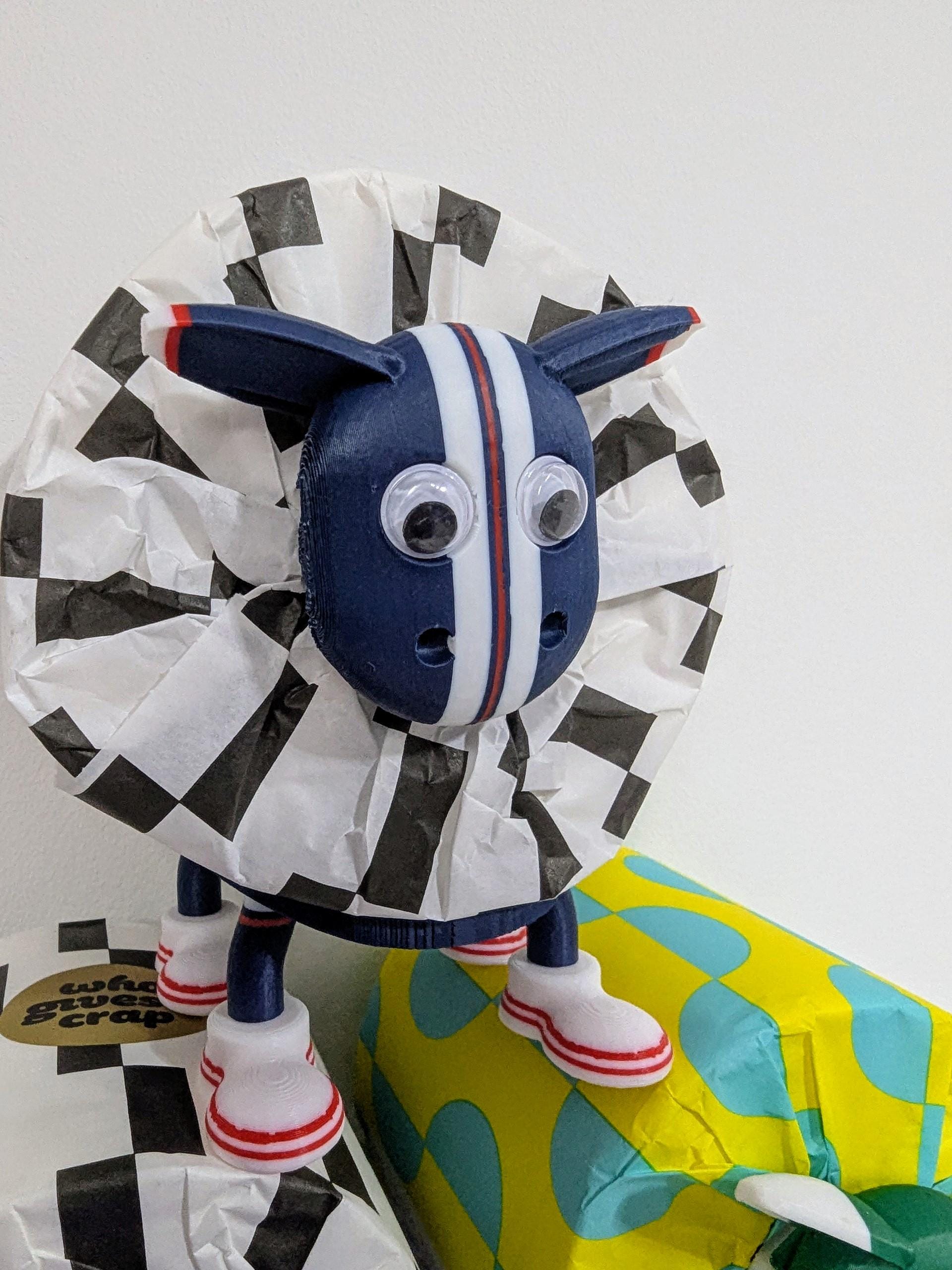 Dundee Scottish Premier Sheep toilet roll holder. 2025 Home shirt with the dees customised football boots.