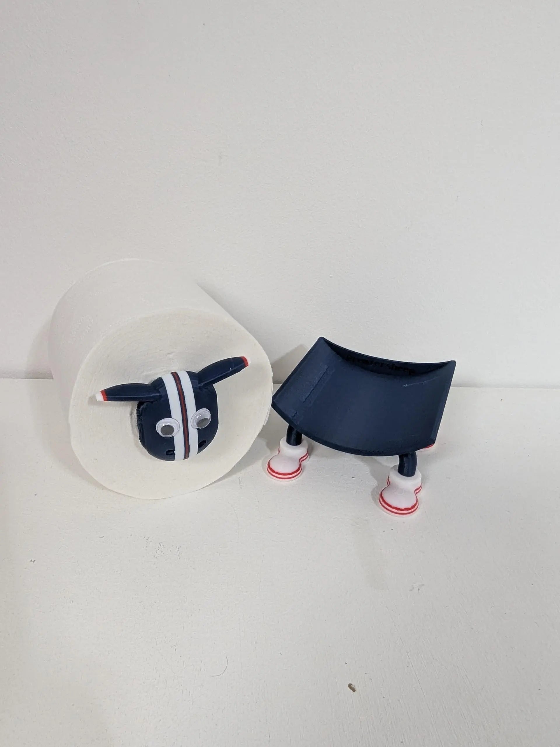 Dundee Scottish Premier Sheep toilet roll holder. 2025 Home shirt with the dees customised football boots.